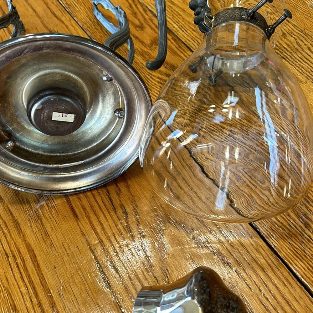 Vintage silver plated tilting coffee stand and carafe. No markings. Glass carafe